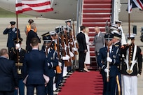 King Charles III shakes hands with Monica Crowley, Chief of Protocol.