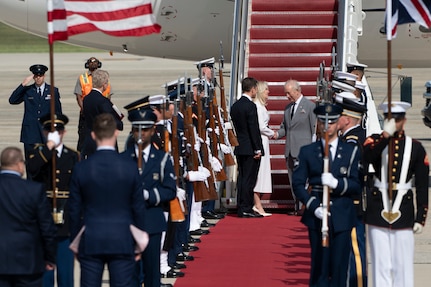 King Charles III shakes hands with Monica Crowley, Chief of Protocol.