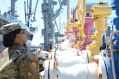 Airmen inspects pipeline infrastructure.