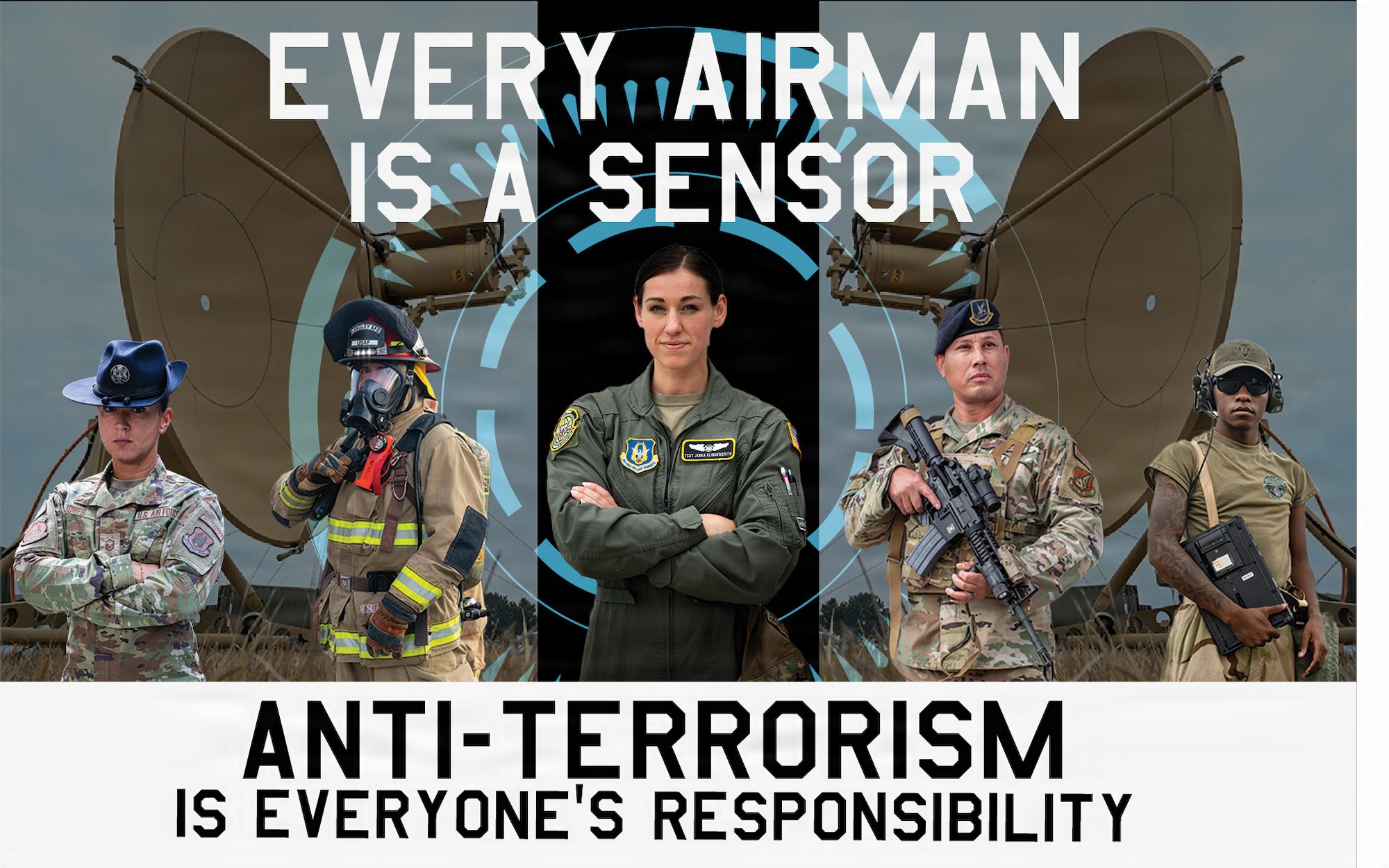 Five U.S. Airmen stand in front of two satellites.