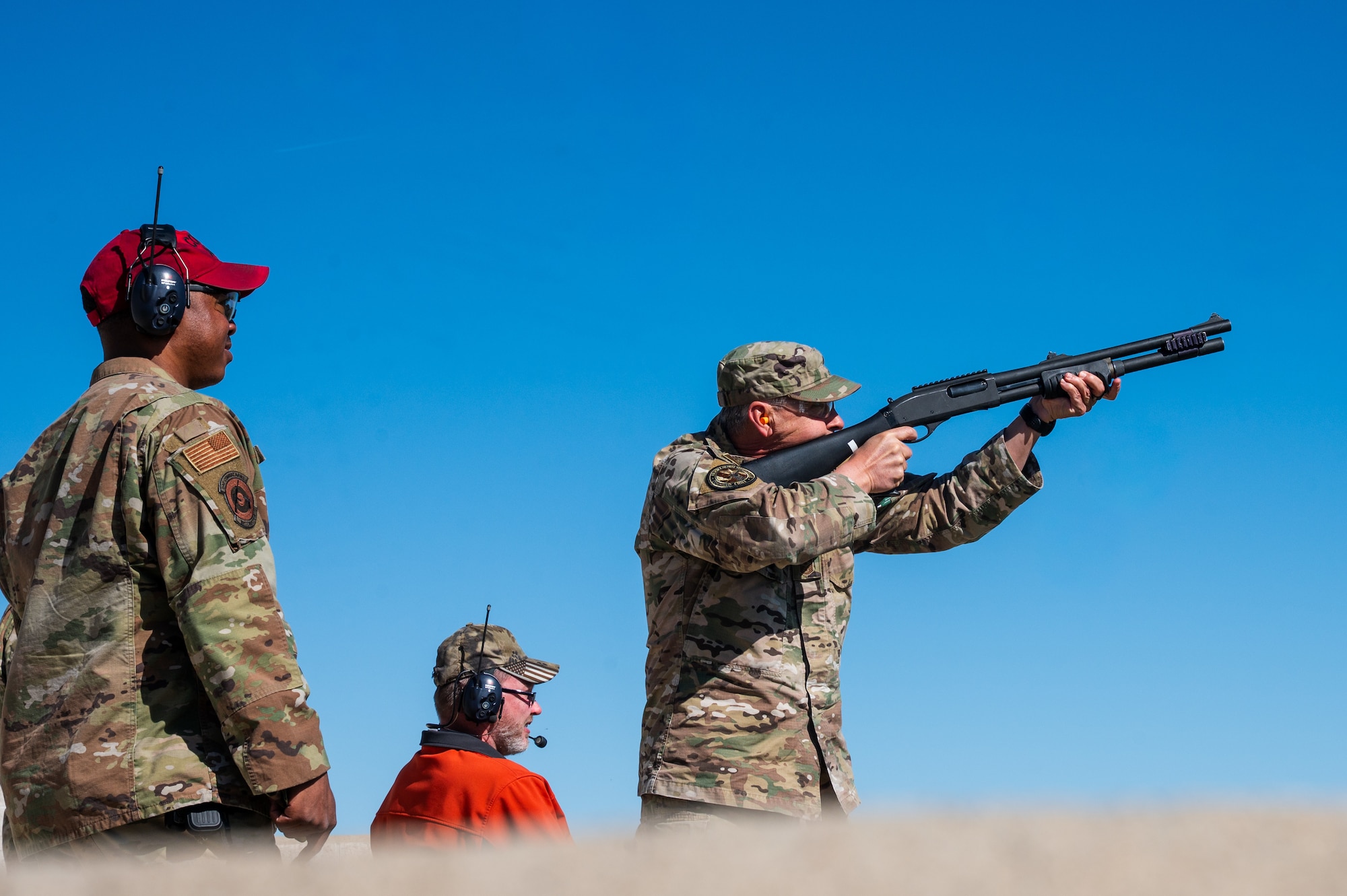 Chief Master Sgt. Aiello fires a Remington M870 MCS shotgun at CATM field.