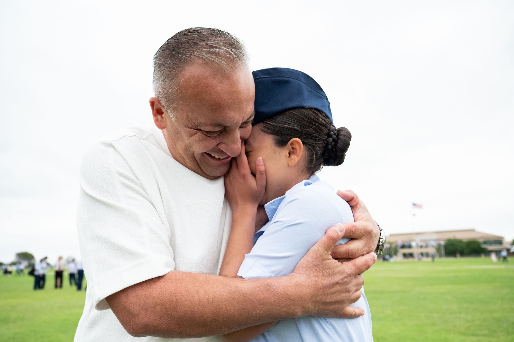 Airman Bryanna Garcia is embraced by her father Jacob Garcia after graduating from the Basic Military Training, May 7, 2026. Airman Garcia’s father served as a Partner Nation Instructor at the at the Inter-American Air Forces Academy in 2006 for two years. Garcia was born in the U.S. and was inspired to follow in her father’s footsteps working in aviation maintenance. (U.S. Air Force photo by Vanessa R. Adame)