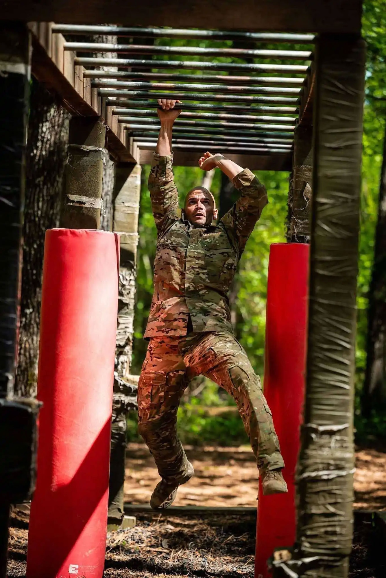Master Sgt. Jesus Cintron, 320th Training Squadron, navigates an obstacle course during the Joint Warrior Competition at Fort Jackson, South Carolina, April 20, 2026. (Photo by Sgt. 1st Class Dana Clarke)