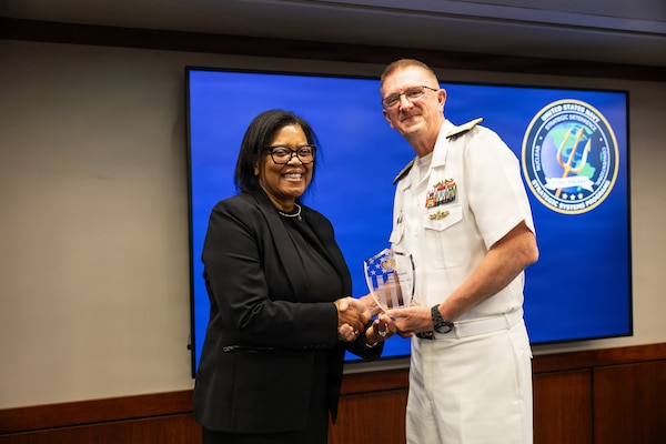 Vice Adm. Johnny Wolfe Jr., director for Portfolio Acquisition Executive (PAE) Strategic Systems Programs (SSP), presents Ms. Tracy Arnold-Berrios, the technical director at PAE SSP and a member of the Senior Executive Service, with the Director’s Award at the biannual Steering Task Group (STG) meeting in Washington D.C. on May 13, 2026. 

Throughout her 38 years of service to the program, Ms. Arnold-Berrios led crucial programs for guided missile submarines (SSGN), infrastructure, and nuclear weapon safety and surety. The Director’s Awards are presented annually with the purpose of recognizing the personal contributions of the PAE SSP government team. To date, only 50 people have received the Director’s Award, including this year’s recipients. Wolfe also presented this year’s Fleet Ballistic Missile Lifetime Achievement Awards at the STG meeting.