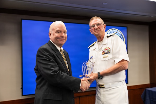Vice Adm. Johnny Wolfe Jr. (right), director for Portfolio Acquisition Executive (PAE) Strategic Systems Programs (SSP), presents Thomas Demo (left), Lockheed Martin Space, with the Fleet Ballistic Missile (FBM) Lifetime Achievement Award in Washington D.C., on May 13, 2026. 

The FBM Lifetime Achievement Award recognizes SSP’s industry partners who demonstrate an unparalleled degree of professionalism and excellence. To date, 121 people have received the award, including this year’s recipients. The FBM Lifetime Achievement Award is sponsored by SSP Historical, Educational and Recognition Organization (HERO), an all-volunteer 501(c) (3) Non-Profit Organization which works to promote awareness and appreciation of the partnership between government and private industry in the development and maintenance of the Navy’s FBM program.