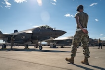 person in front of jet