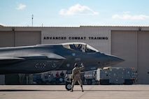 person standing in front of jet