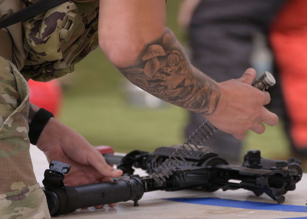 A U.S. Airman assigned to the 56th Security Forces Squadron assembles a firearm during a skills observation held during 2026 Police Week at Luke Air Force Base, Arizona, May 13, 2026. The event focused on weapon systems skills, preparedness and teamwork critical of military law enforcement officers in support of the nation’s defense posture and projection of the global strategic mission. (U.S. Air Force photo by Airman 1st Class Rebecca Wagner)