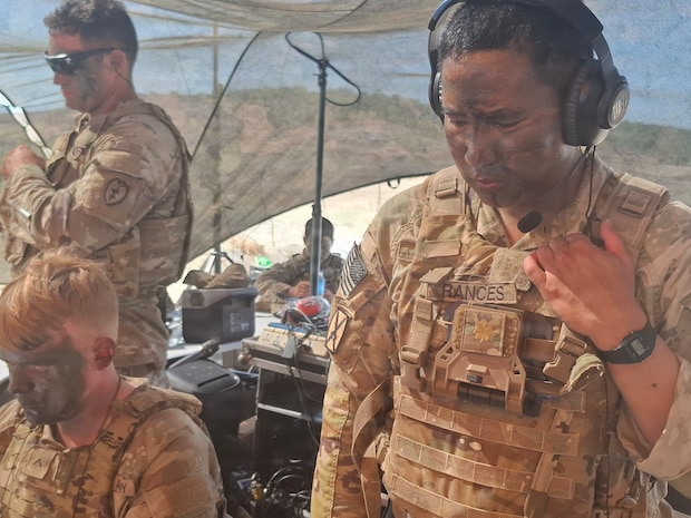 U.S. Army Maj. Ryan Rances, 125th Intelligence and Electronic Warfare Battalion operations officer, 25th Infantry Division, monitors execution checks during a counter-landing live-fire exercise alongside the Armed Forces of the Philippines and the Japan Ground Self-Defense Force during Exercise Balikatan 2026 at La Paz Sand Dunes, Laoag City, Philippines, May 4, 2026.