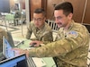 U.S. Army Spc. Justin Xu, 1st Multi-Domain Effects Battalion, and New Zealand Army Lance Cpl. Liam Van Der Mespel, 1st Command Support Regiment, analyze data for Blue Team 6 during the Balikatan 2026 cyber defense exercise at Camp Aguinaldo, Philippines, April 29, 2026.