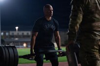 An Air Force military training instructor conducts the three-repetition, maximum dead lift while  competing alongside drill sergeants and drill sergeant leaders during the Fort Jackson & USADSA Drill Sergeant of the Year competition as part of the Joint Warrior Competition at Fort Jackson, South Carolina, April 20, 2026. The Joint Warrior Competition provides an opportunity for drill instructors from other branches to compete against U.S. Army drill sergeants as part of a joint collaboration to share ideas.