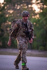 Master Sgt. Jesus Cintron, 320th Training Squadron, during a 12-mile ruck march while carrying a 35-pound dry load, an Advanced Combat Helmet, Tactical Assault Panel, and his rifle during the Joint Warrior Competition at Fort Jackson, South Carolina, April 20, 2026. (Photo by Sgt. 1st Class Dana Clarke)