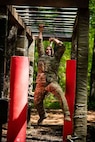 Master Sgt. Jesus Cintron, 320th Training Squadron, navigates an obstacle course during the Joint Warrior Competition at Fort Jackson, South Carolina, April 20, 2026. (Photo by Sgt. 1st Class Dana Clarke)