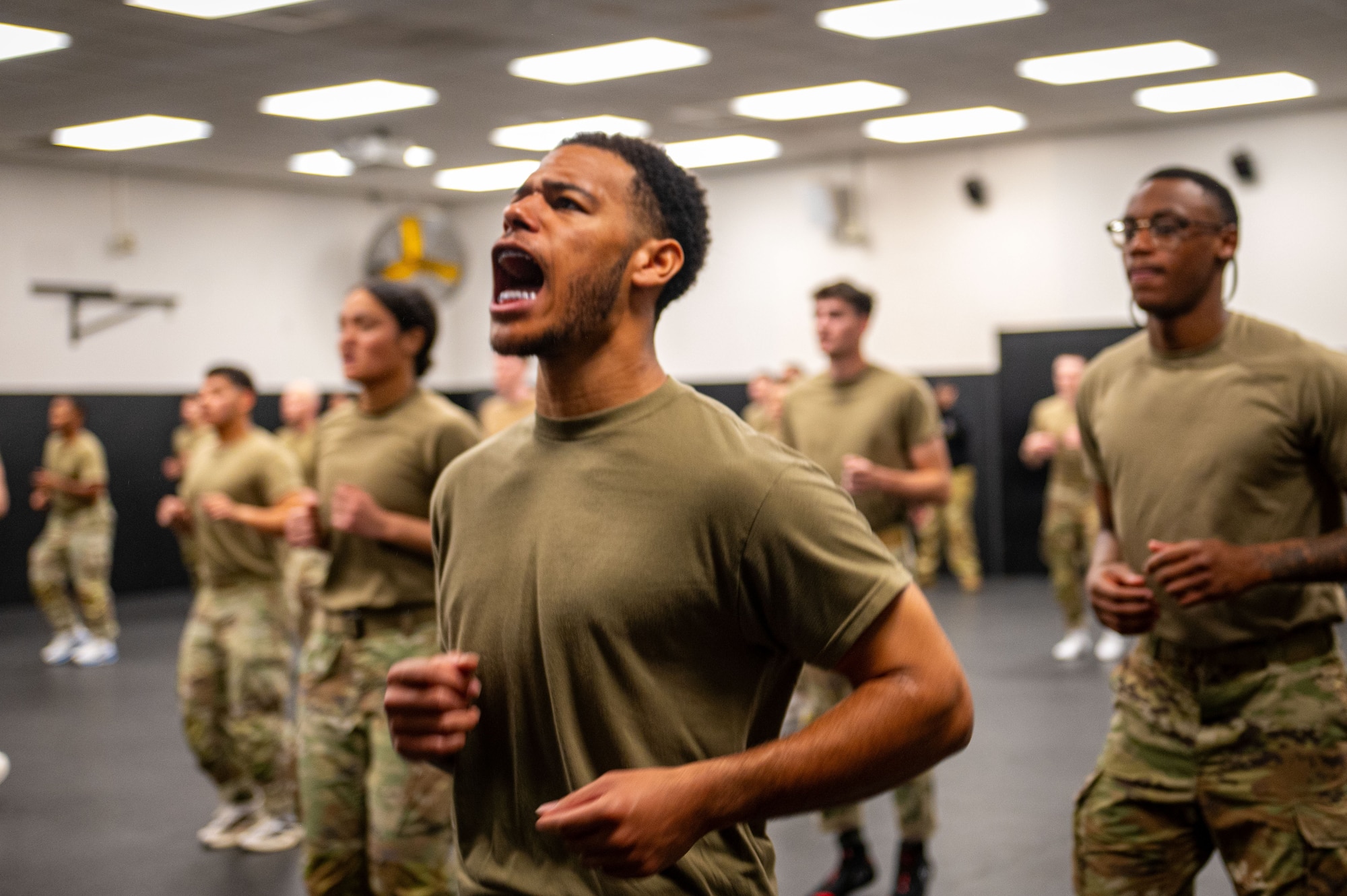 U.S. Air Force Staff Sgt. Daniel James, 11th Security Forces Squadron Base Defense Operations Center operator at Joint Base Andrews, Md., shouts during combatives training in the Phoenix Raven Qualification Course at Joint Base McGuire-Dix-Lakehurst, N.J., April 21, 2026.