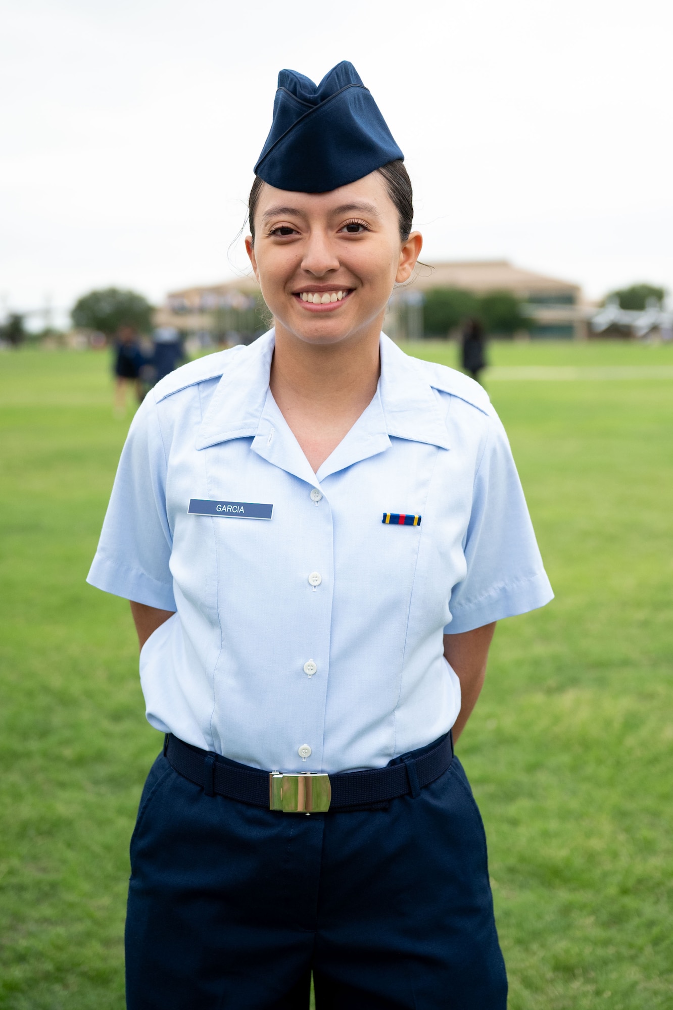 Airman Bryanna Garcia, stands at the parade field after graduating from Basic Military Training, May 7, 2026. Her father Jacob Garcia served as a Partner Nation Instructor at the Inter-American Air Forces Academy in 2006 for two years. Garcia was born in the U.S. and was inspired to follow in her father’s footsteps. (U.S. Air Force photo by Vanessa R. Adame)