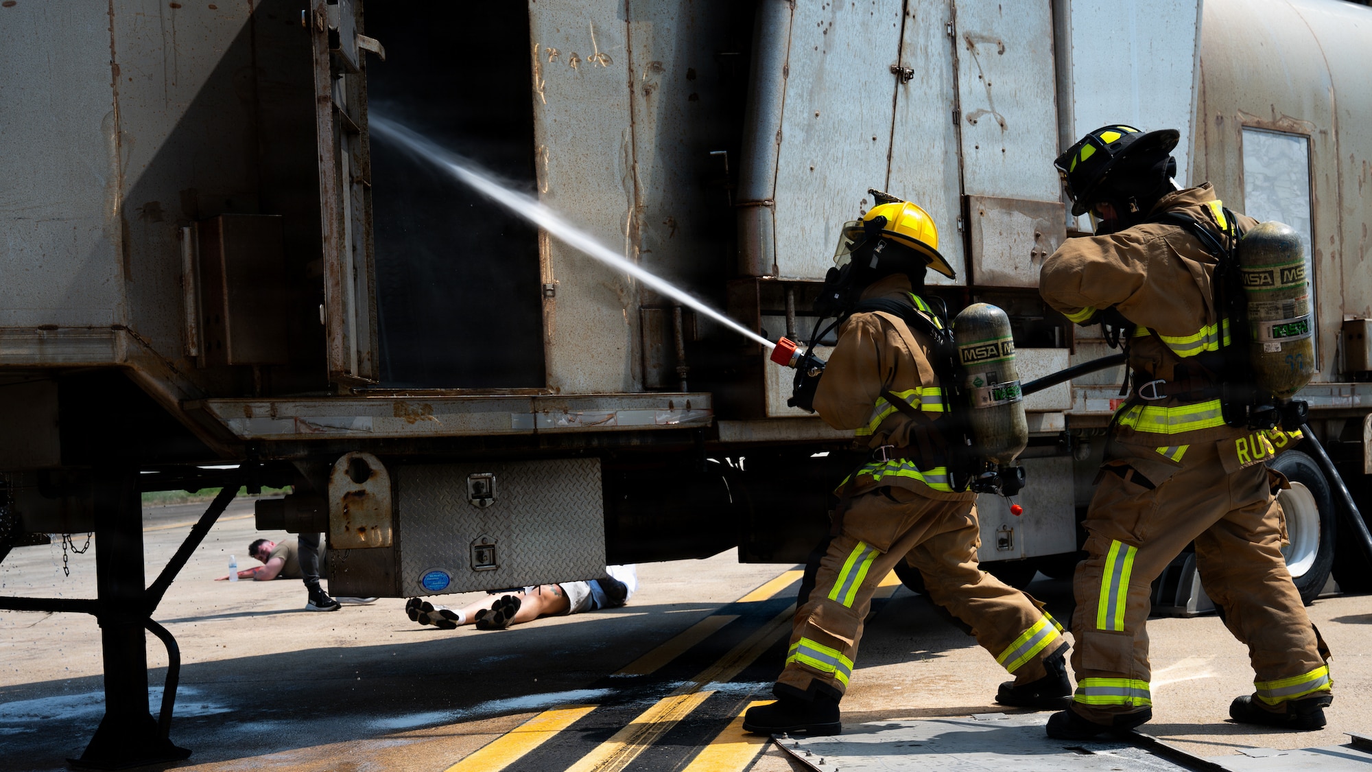 Firefighters assigned to the 51st Civil Engineer Squadron spray water on an aircraft trainer during a major accident response exercise as part of exercise Mustang Rodeo 26-2 at Osan Air Base, Republic of Korea, May 14, 2026.