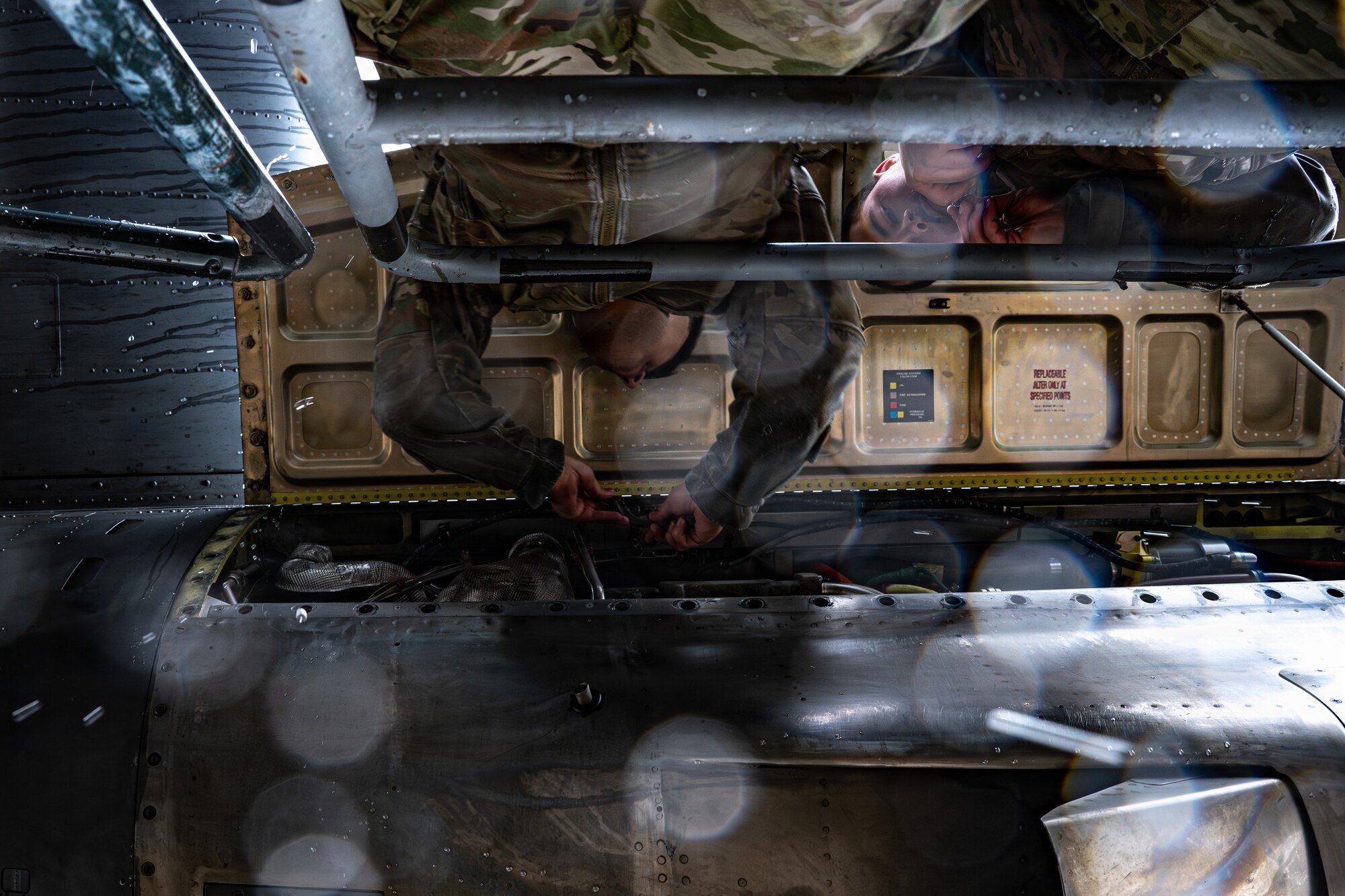 U.S. Air Force Airman 1st Class Andrew Lowe, left, Airman 1st Class Alejandro Calderon, 86th Aircraft Maintenance Squadron maintainers, complete engine repairs on a C-130J Hercules at Ramstein Air Base, Germany, May 14, 2026.