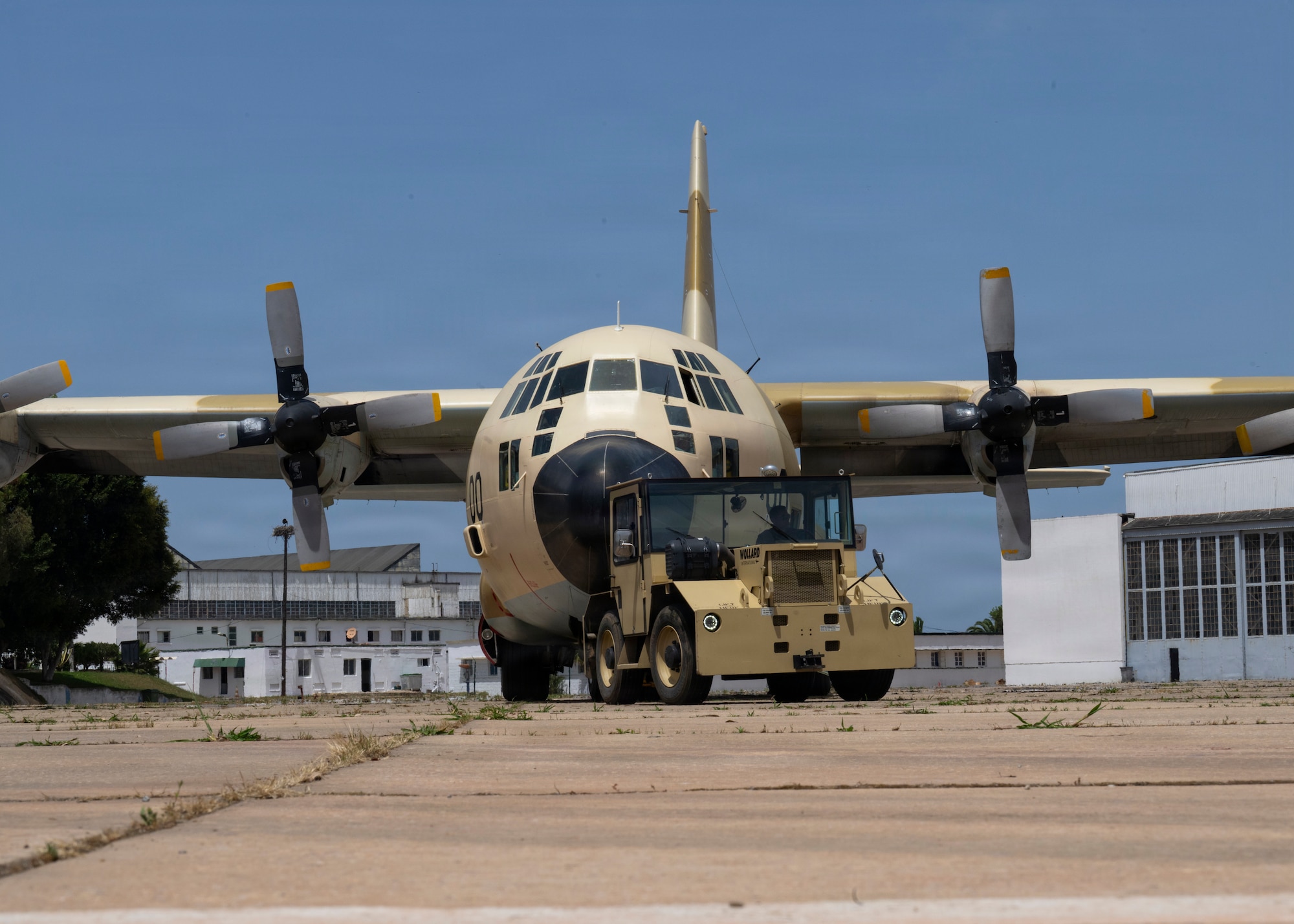 Service members assigned to the 3rd Royal Moroccan Airmen tow a Royal Moroccan Air Force C-130H to a loading zone during Africa Lion 26 at 3rd Royal Moroccan Air Base, Kenitra, Morocco, April 27, 2026.