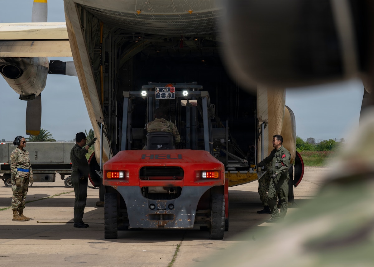 U.S. Air Force Senior Airman Adamu Issaka, a load joint inspection representative assigned to 88th Aerial Port Squadron, loads gear onto a Royal Moroccan Air Force C-130H to demonstrate engine running on and offloading procedures during Africa Lion 26 at 3rd Royal Moroccan Air Base, Kenitra, Morocco, April 27, 2026.