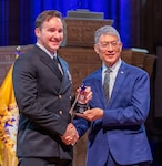 Chief Hospital Corpsman Robert Murphy receives the Hero of Military Medicine Award from Joseph Caravalho, president and chief executive officer of the Henry M. Jackson Foundation for the Advancement of Military Medicine, May 7 in Washington, D.C. The annual Heroes of Military Medicine awards recognize outstanding contributions by senior leaders, medical professionals, and civilians working in the Department of War.