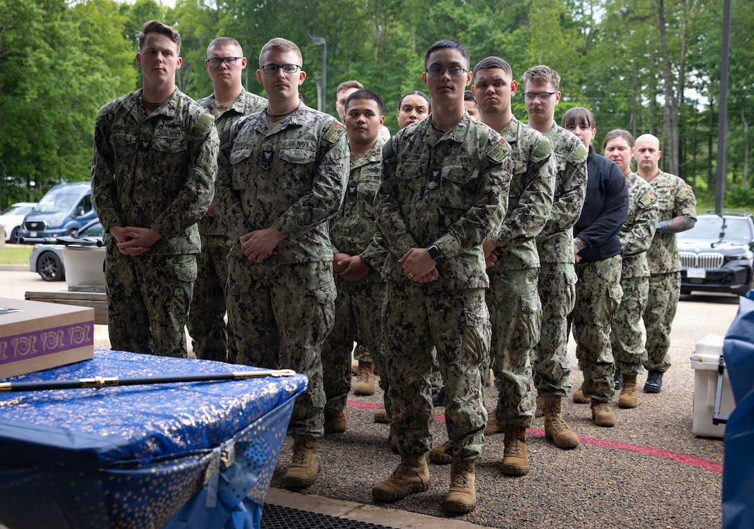 U.S. Navy hospital corpsmen with the David R. Ray Branch Health Clinic stand in formation during the Nurse Appreciation Week cake cutting ceremony at the David R. Ray Branch Health Clinic on Marine Corps Base Quantico, Virginia, May 13, 2026. The cake cutting ceremony reflects on the history of the Nurse Corps and symbolizes the passing of knowledge from the most senior officer to the most junior officer. (U.S. Marine Corps photo by Sgt. Chancellor Reynolds)