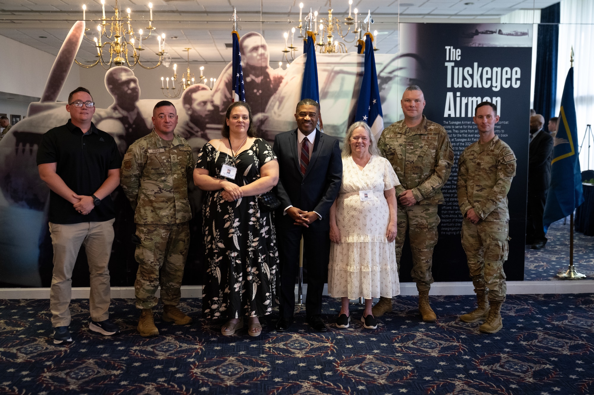 A group stands posed for a photo.