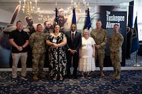 A group stands posed for a photo.