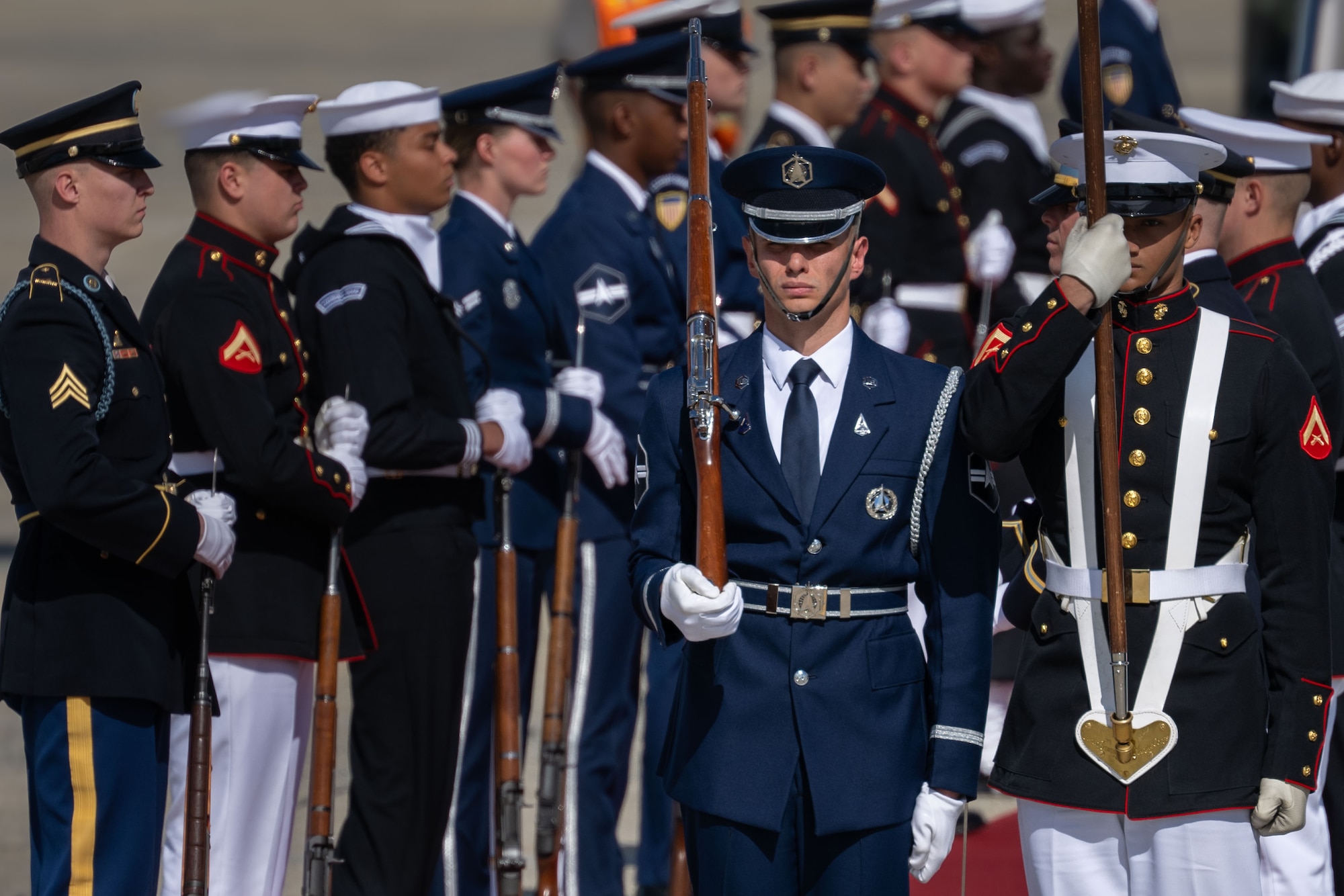 Members of the Joint Service Color Guard and cordon present ceremonial honors during a departure ceremony for King Charles III.
