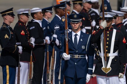 Members of the Joint Service Color Guard and cordon present ceremonial honors during a departure ceremony for King Charles III.