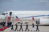 Members of the Joint Service Color Guard and cordon present ceremonial honors during a departure ceremony for King Charles III.