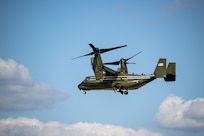 A U.S. Marine Corps MV-22 Osprey aircraft flies in.