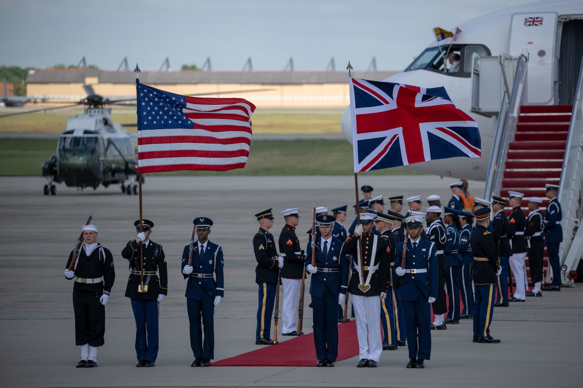 Members of the Joint Service Color Guard and cordon present ceremonial honors during a departure ceremony for King Charles III.