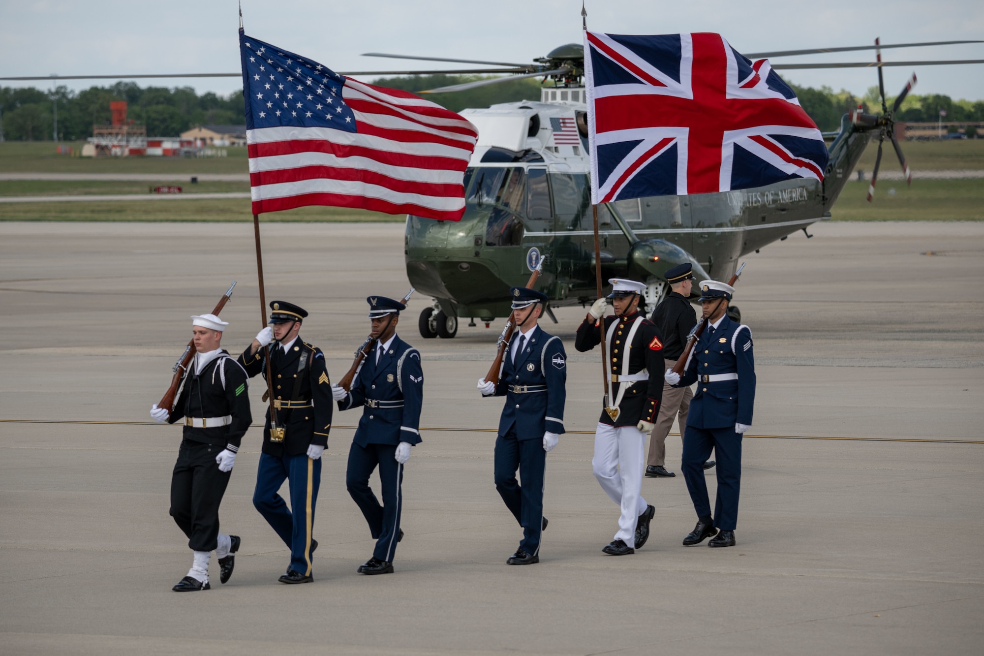 Members of the Joint Service Color Guard and cordon present ceremonial honors during a departure ceremony for King Charles III.