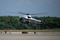 A helicopter lands before a departure ceremony for King Charles III.