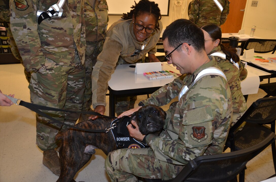 In recognition of Nurse Tech Week, Bowser the Therapy Dog visits students and staff in the Medical Education and Training Campus Air Force Aerospace Medical Service Apprentice course May 8.