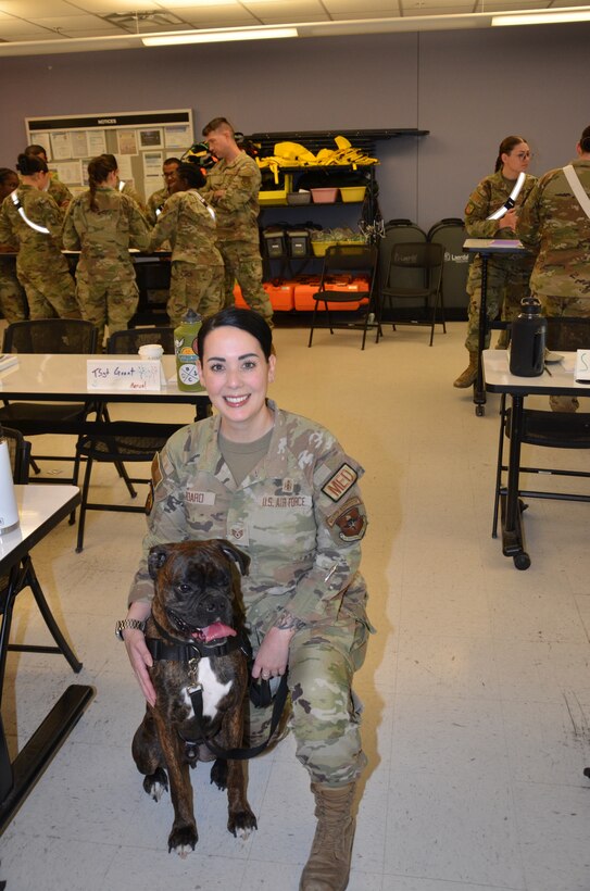 In recognition of Nurse Tech Week, Bowser the Therapy Dog visits students and staff in the Medical Education and Training Campus Air Force Aerospace Medical Service Apprentice course May 8.