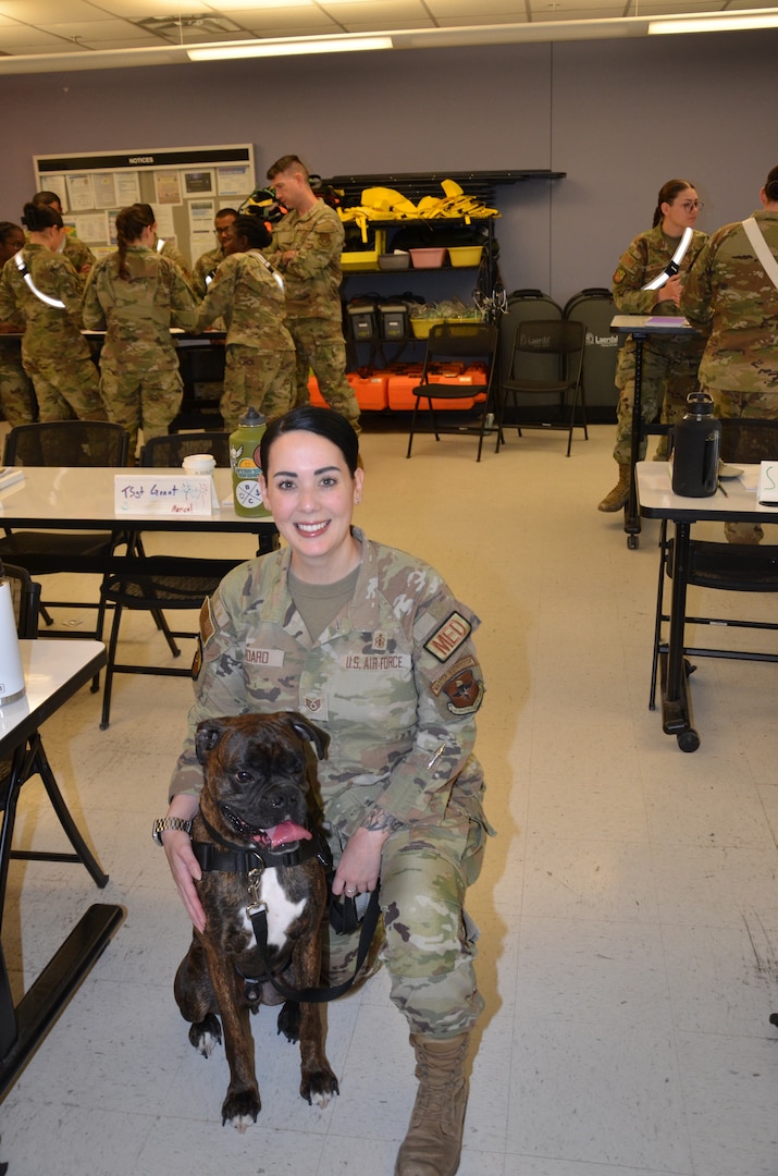 In recognition of Nurse Tech Week, Bowser the Therapy Dog visits students and staff in the Medical Education and Training Campus Air Force Aerospace Medical Service Apprentice course May 8.
