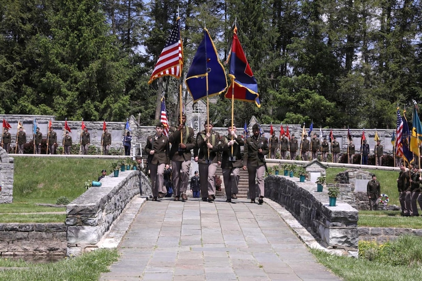 A procession of unit guidons and colors marches toward the reviewing stand at the start of the 28th Infantry Division’s annual memorial service May 17, 2026, in Boalsburg, Pennsylvania. Each year Soldiers from the 28th Infantry Division participate in an annual memorial ceremony at the 28th Division Shrine on the grounds of the Pennsylvania Military Museum in Boalsburg to recognize the fallen and their Gold Star families, along with the strength and honor that comes with the 28th Infantry Division.(U.S. Army National Guard photo by Staff Sgt. Kenneth Shirk)