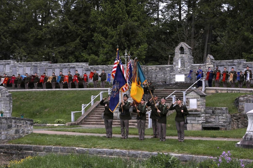 Soldiers hold colors and guidons representing organizations within the division during the 28th Infantry Division’s annual memorial service May 17, 2026, in Boalsburg, Pennsylvania. Each year Soldiers from the 28th Infantry Division participate in an annual memorial ceremony at the 28th Division Shrine on the grounds of the Pennsylvania Military Museum in Boalsburg to recognize the fallen and their Gold Star families, along with the strength and honor that comes with the 28th Infantry Division. (U.S. Army National Guard photo by Staff Sgt. Kenneth Shirk)