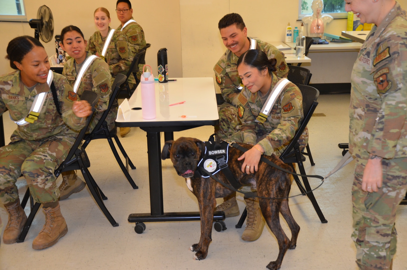 In recognition of Nurse Tech Week, Bowser the Therapy Dog visits students and staff in the Medical Education and Training Campus Air Force Aerospace Medical Service Apprentice course May 8.