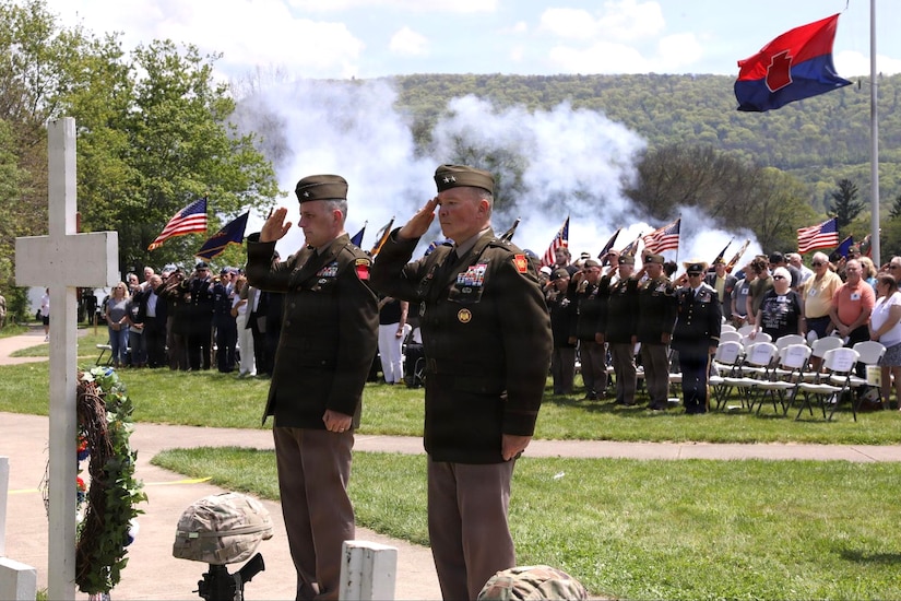 Maj. Gen. John R. Pippy, right, Pennsylvania adjutant general, and Brig. Gen. Reese J. Lutz, left, commander of the 28th Infantry Division, salute during the firing of a ceremonial salute at the division’s annual memorial service May 17, 2026, in Boalsburg, Pennsylvania. The memorial service honored fallen Soldiers of the 28th Infantry Division and recognized Gold Star families at the 28th Infantry Division Shrine on the grounds of the Pennsylvania Military Museum. (U.S. Army National Guard photo by Staff Sgt. Kenneth Shirk)