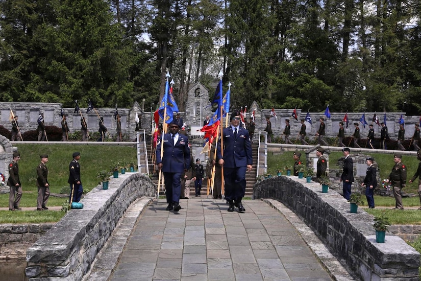 Pennsylvania National Guard service members carry unit guidons across a stone footbridge following the 28th Infantry Division’s annual memorial service May 17, 2026, in Boalsburg, Pennsylvania. The memorial service honored fallen Soldiers of the 28th Infantry Division and recognized Gold Star families at the 28th Infantry Division Shrine on the grounds of the Pennsylvania Military Museum. (U.S. Army National Guard photo by Staff Sgt. Kenneth Shirk)