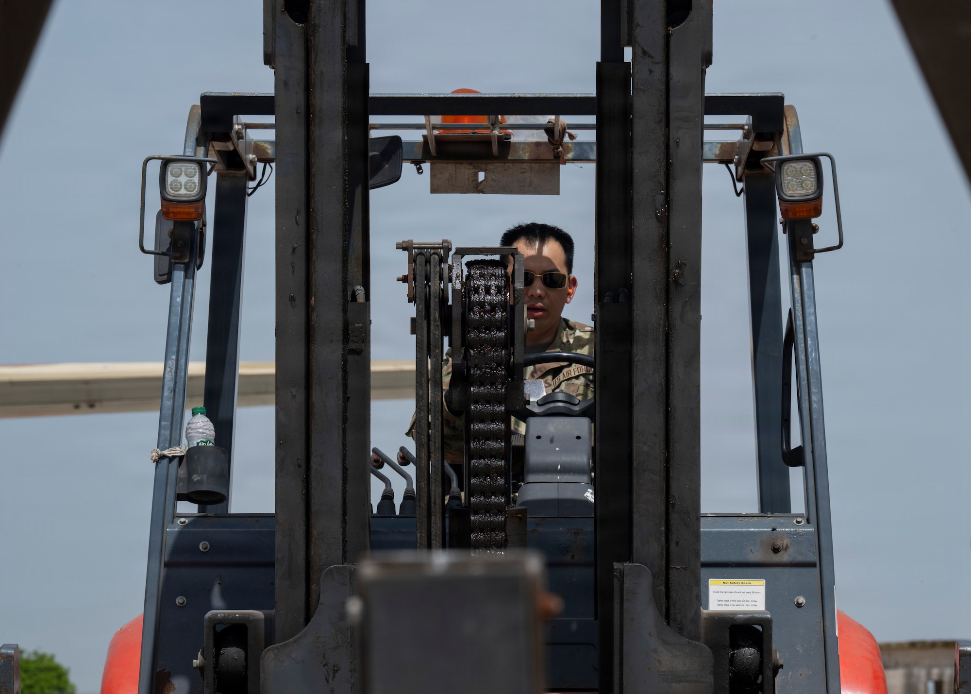 U.S. Air Force Senior Airman Jeffrey Tan, a load joint inspection representative assigned to the 88th Aerial Port Squadron, begins engine running on and offloading procedures by operating a forklift during Africa Lion 26 at 3rd Royal Moroccan Air Base, Kenitra, Morocco, April 27, 2026.