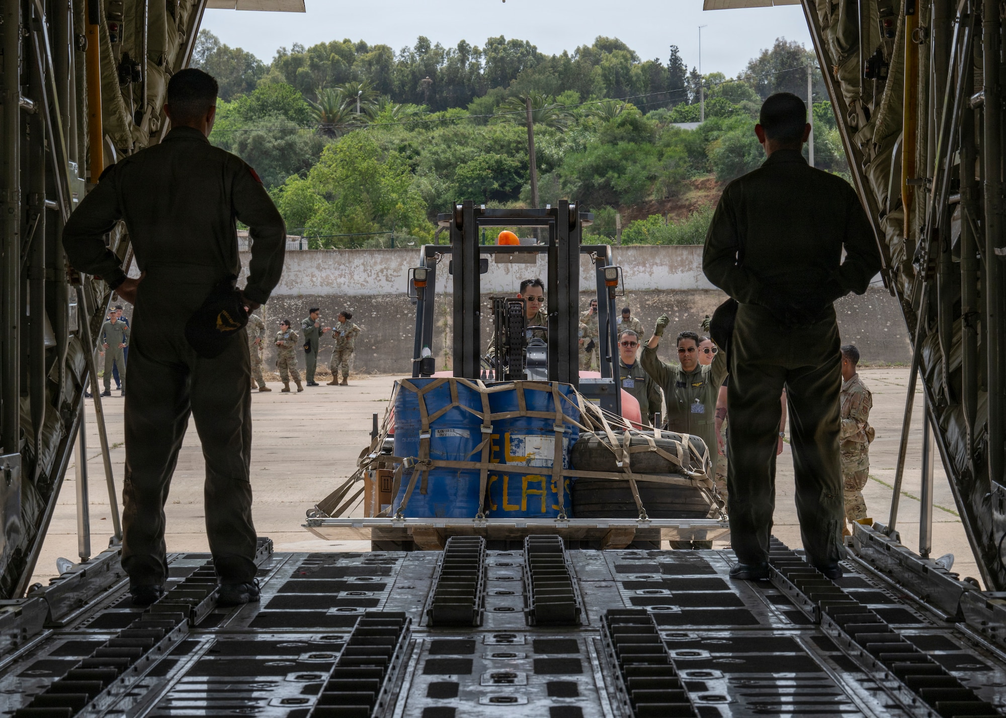 U.S. Air Force Senior Airman Jeffrey Tan, a load joint inspection representative, begins to load gear onto a Royal Moroccan Air Force C-130H to demonstrate engine running on and offloading procedures during Africa Lion 26 at 3rd Royal Moroccan Air Base, Kenitra, Morocco, April 27, 2026.