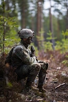 U.S. Army Sgt. Thomas Olsen, an infantryman team leader, with 2nd Platoon, Charlie Company, 4th Battalion, 70th Armor Regiment, 1st Armored Brigade Combat Team, 1st Armored Division, waits along the woodline as his squad prepares for a live-fire situational training exercise at Vuosanka Training Area, Finland, May 15, 2026. From April 27 to May 31, 2026 U.S. and Allied forces will exercise NATO’s Eastern Flank Deterrence Initiative, demonstrating NATO’s ability to fight and win on the modern battlefield. Nearly 15,000 troops from eleven nations will train across the High North, Baltic region, and Poland, executing rapid maneuvers, air defense, counter-drone operations, and cyber defense to validate NATO’s regional defense plans in real time. This series of linked exercises, including Saber Strike, Immediate Response, and Swift Response, turns investment into capability. Soldiers integrate unmanned systems, AI-enabled command and control, and live data networks to move faster, decide faster, and fight more effectively across all domains. Sword 26 demonstrates how U.S. Army Europe and Africa drives transformation at scale while strengthening deterrence. Together with our Allies, we are building a unified, lethal force ready to defend NATO territory and respond to any threat. (U.S. Army Reserve photo by Sgt. Addison Shinn)