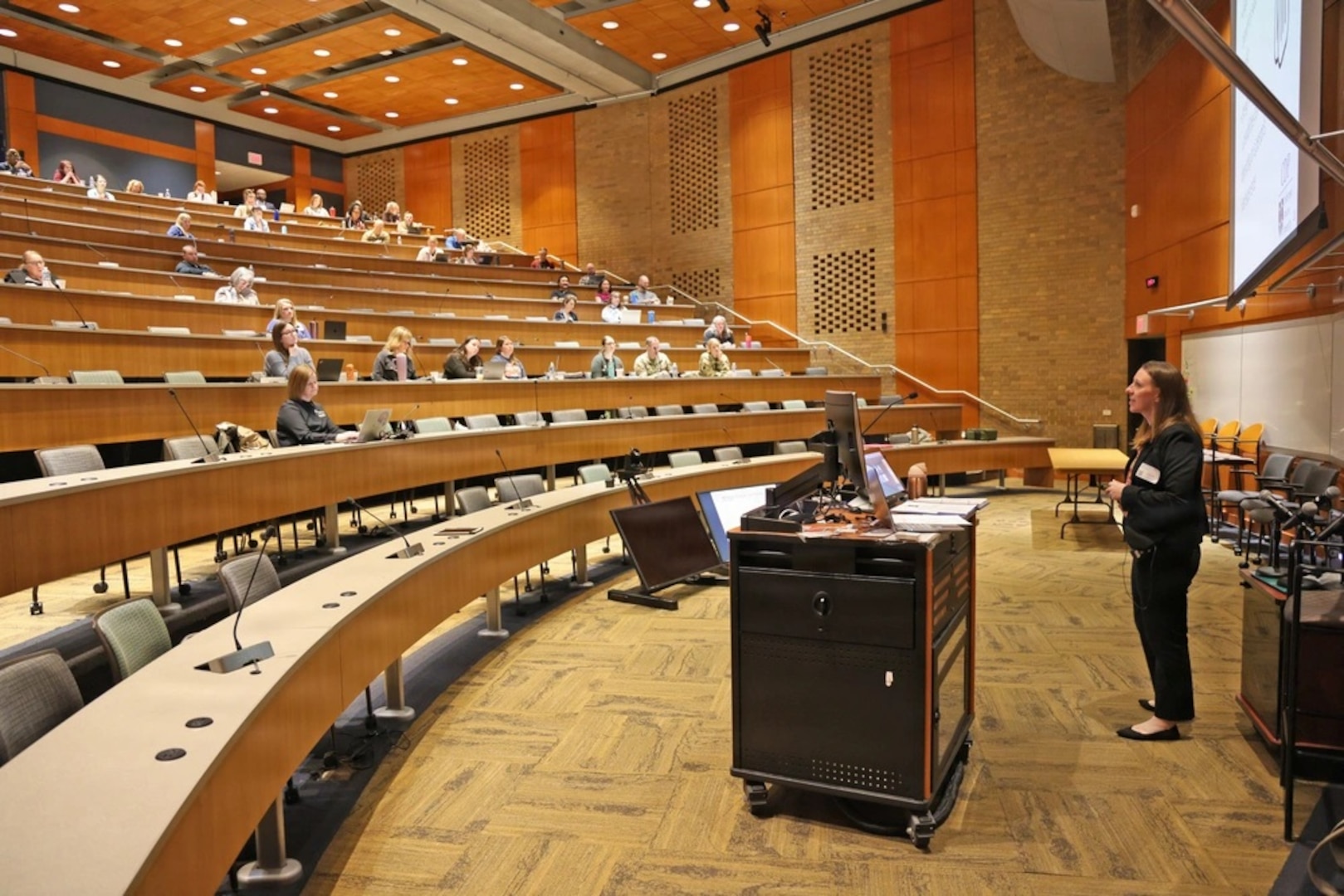 Allison Hannah presenting in a lecture hall.