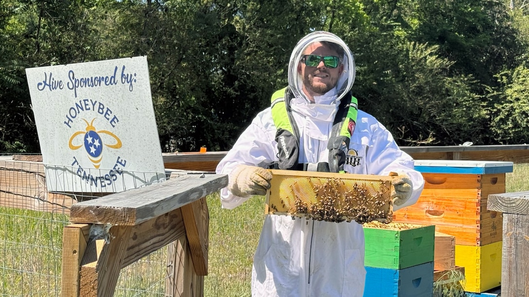 U.S. Army Corps of Engineers Nashville District Park Ranger Garrett Stone wears his inflatable life jacket while attending to the bee hive at Cordell Hull Lake May 15, 2026, in Carthage, Tennessee, while participating in “Wear Your Life Jacket to Work Day.” (USACE Photo)