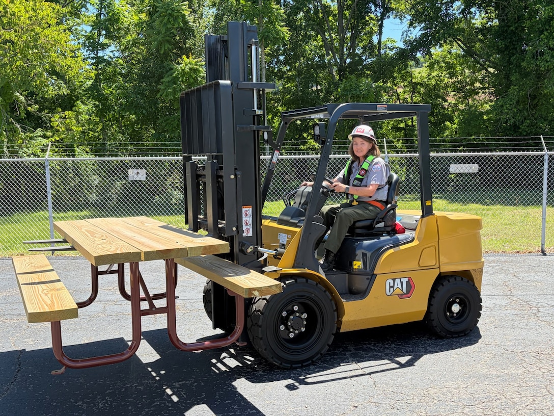 U.S. Army Corps of Engineers Nashville District Park Ranger Sheila Kirk wears her inflatable life jacket while moving a picnic table with a forklift at Cordell Hull Lake May 15, 2026, in Carthage, Tennessee, while participating in “Wear Your Life Jacket to Work Day.” (USACE Photo)