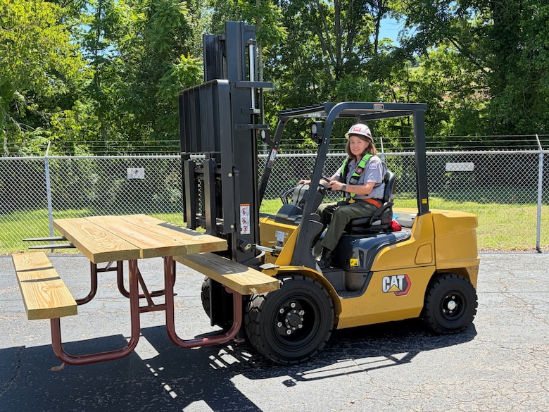 U.S. Army Corps of Engineers Nashville District Park Ranger Sheila Kirk wears her inflatable life jacket while moving a picnic table with a forklift at Cordell Hull Lake May 15, 2026, in Carthage, Tennessee, while participating in “Wear Your Life Jacket to Work Day.” (USACE Photo)