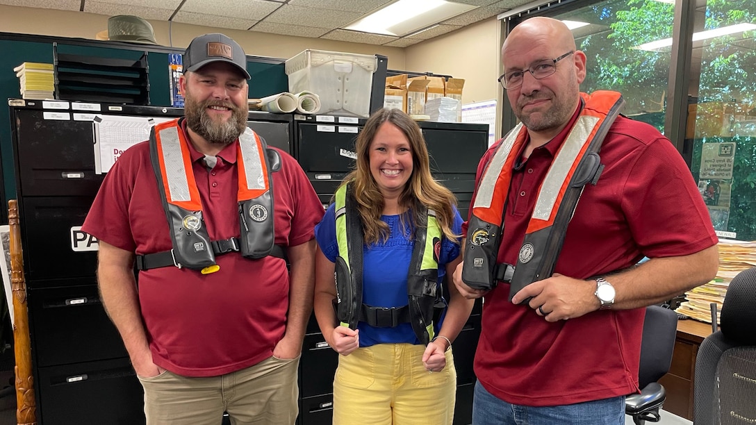 U.S. Army Corps of Engineers Nashville District employees (Left to Right) Dan Mchone, Tanara Babcock, and Caleb Skinner wear inflatable life jackets at Lake Barkley May 15, 2026, in Grand Rivers, Kentucky, while participating in “Wear Your Life Jacket to Work Day.” (USACE Photo)